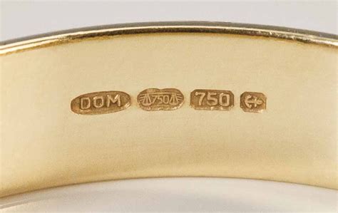 So, 18K signifies that it contains only 18 parts gold and six parts another metal. . Gm69 gold stamp